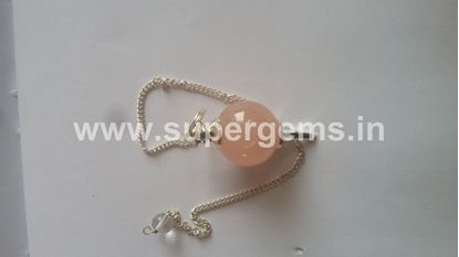 Picture of rose quartz ball pendulums